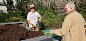 Master Gardeners spreading Zoo Doo at Ronald McDonald House outreach garden
